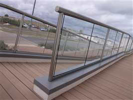Long balustrade with clear glass and Royal Chrome handrails and posts