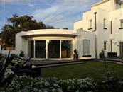Curved Glass Sliding Doors supplied by Balcony Systems transforms B&B on the South Coast