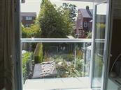 Self-Cleaning Glass Juliet Balcony reduces the maintenance for couple in Sheffield.