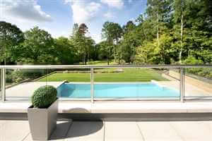 Royal Chrome balustrade looking over swimming pool and beautiful grounds