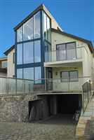 interestingly shaped house with Royal Chrome balustrading and handrails