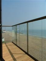 coastal panoramic view through the glass of a balcony Lancing, West Sussex