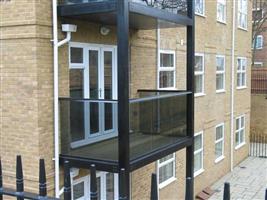 glass balconies on a metal structure bristol