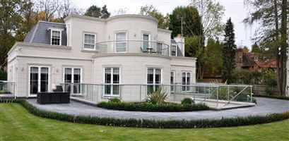 Grand white house with silver balustrading and Juliet balconies