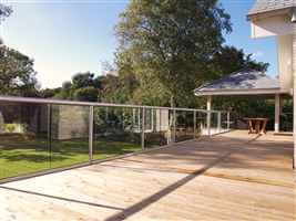 Long stretch of beautiful balustrading with silver posts and handrails and a lovely countryside view