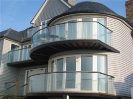 glass curved balcony near kent