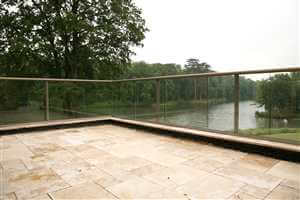 View through Bronze clear glass balcony to a lake