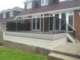 Balustrade with Royal Chrome handrails and posts and tinted glass