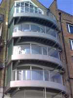 Curved silver balcony 1 balustrade overlooking the Thames