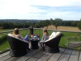 Girls sitting on the balcony in Sussex