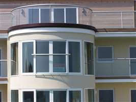 Silver balustrading and Juliet balconies on seafront residences