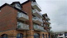 Glass Balustrades by Balcony Systems transform London riverside apartment block. Innovative and quality glass balcony replaced the original steel railings bolted to the concrete slab balconies.