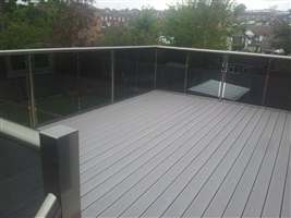 Royal Chrome balustrade with tinted glass and Composite Decking