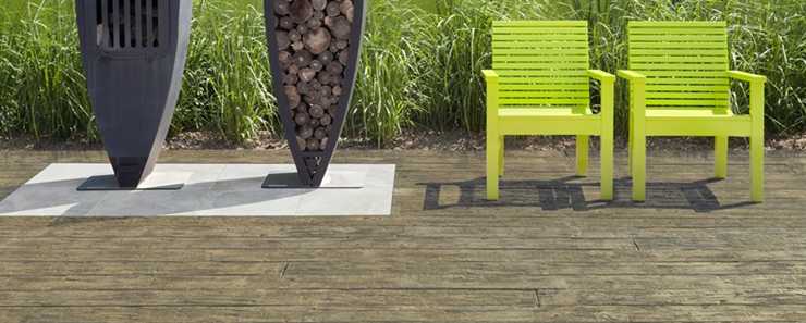 Weathered Composite Decking with chairs and logs