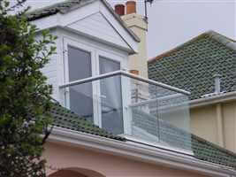 Loft conversion balcony with silver handrail