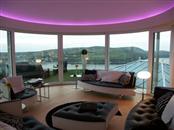 Fantastic panoramic views of the Isle of Man from a luxurious bed and breakfast property with Balcony's low-maintenance clear glass balustrading and curved sliding patio doors. 