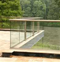 Zigzag bronze handrail balustrade with clear glass and bronze handrail