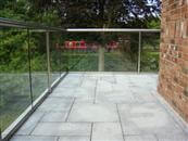 39 metre curved and straight self-cleaning glass balustrading added to canalside home to accentuate views. 