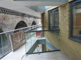 glass balustrade on a void london