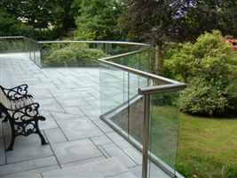 Curved and straight canalside balcony with a bench to sit on and look over the gardens
