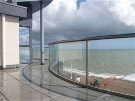 Curved Royal Chrome balustrade overlooking the seaside
