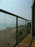 durable handrails and glass in front of the sea Lancing, West Sussex