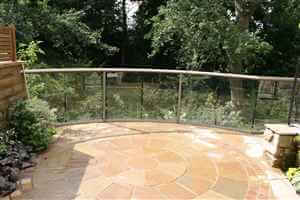 Bronze balcony 1 curved balustrade with detailed patio and garden with trees