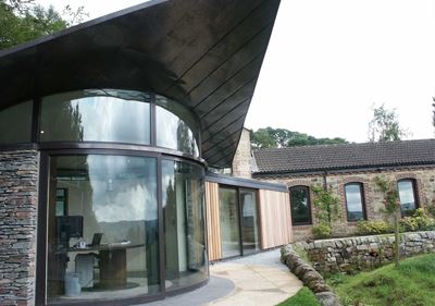 A luxury office building with Curved Glass Sliding Doors