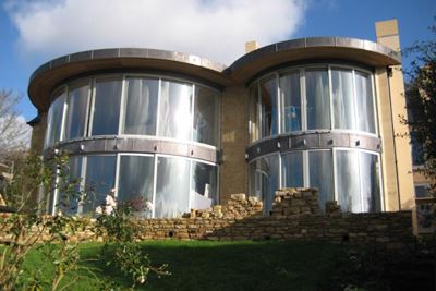 Multiple sets of Curved Glass Doors installed in a modern property 
