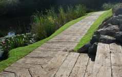 Non-rot plastic decking board for wetland areas