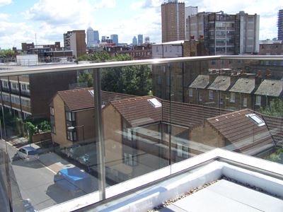 Urban view from the corner of a Aerofoil Royal Chrome Glass Balustrade