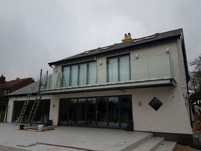 Frameless Glass Balustrade installed on a modern property with a garage
