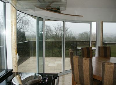 White Curved Glass Doors installed in a kichen diner